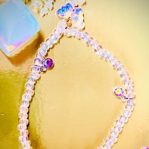 A beautiful iridescent rainbow of bracelet, with butterfly’s